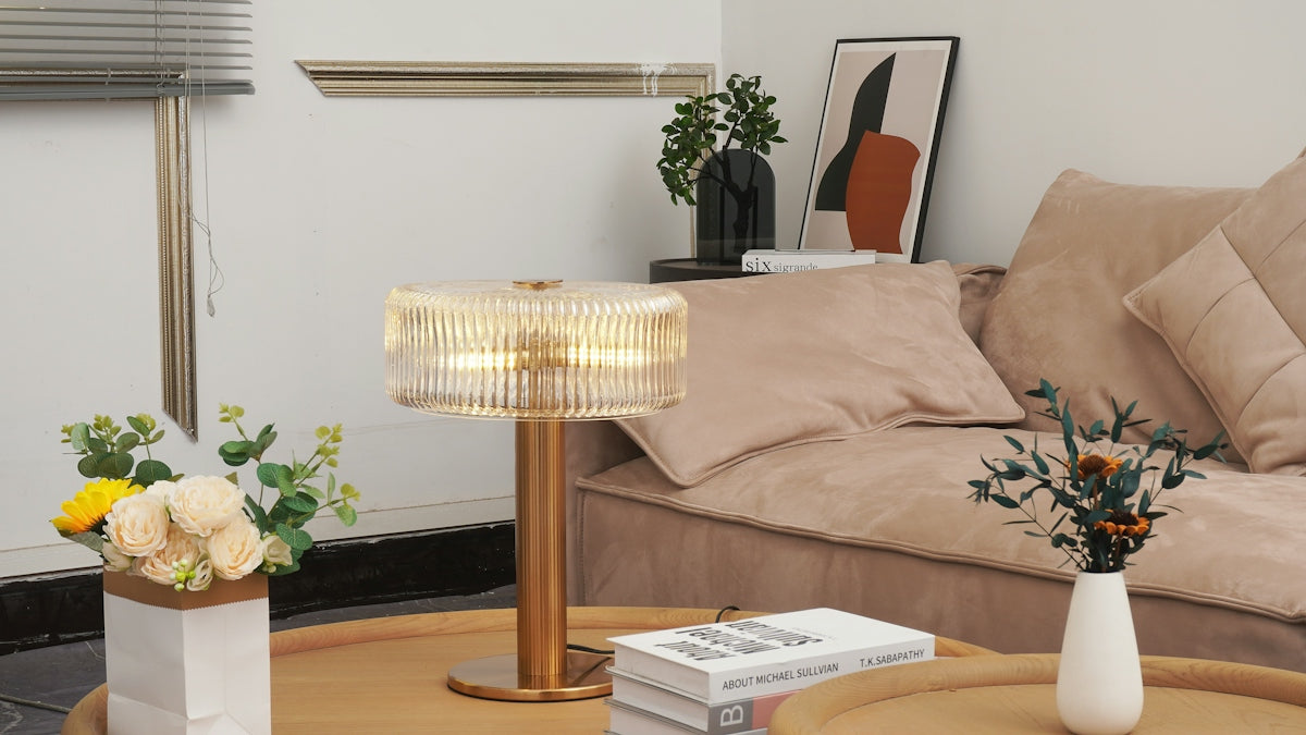 A modern lamp on a coffee table with flowers